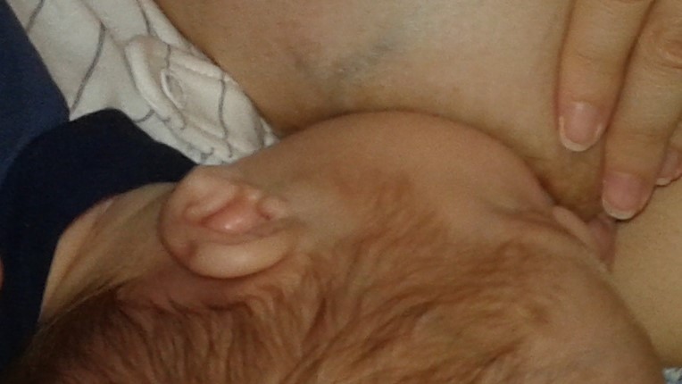 Photo: Mother feeding child