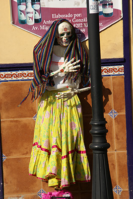 Photo: Catrina in yellow dress, wrapped in shawl
