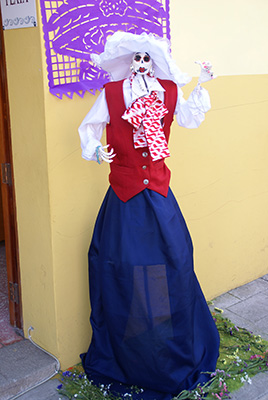 Photo: Catrina with red top, blue dress and white hat