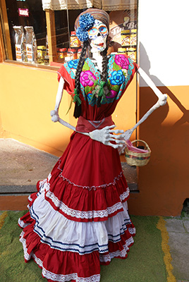 Photo: Catrina with red dress carrying a basket