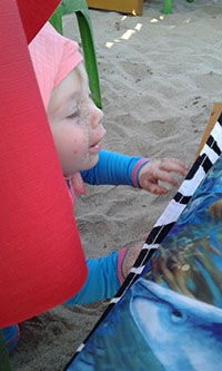 Photo: Victor looking out house window