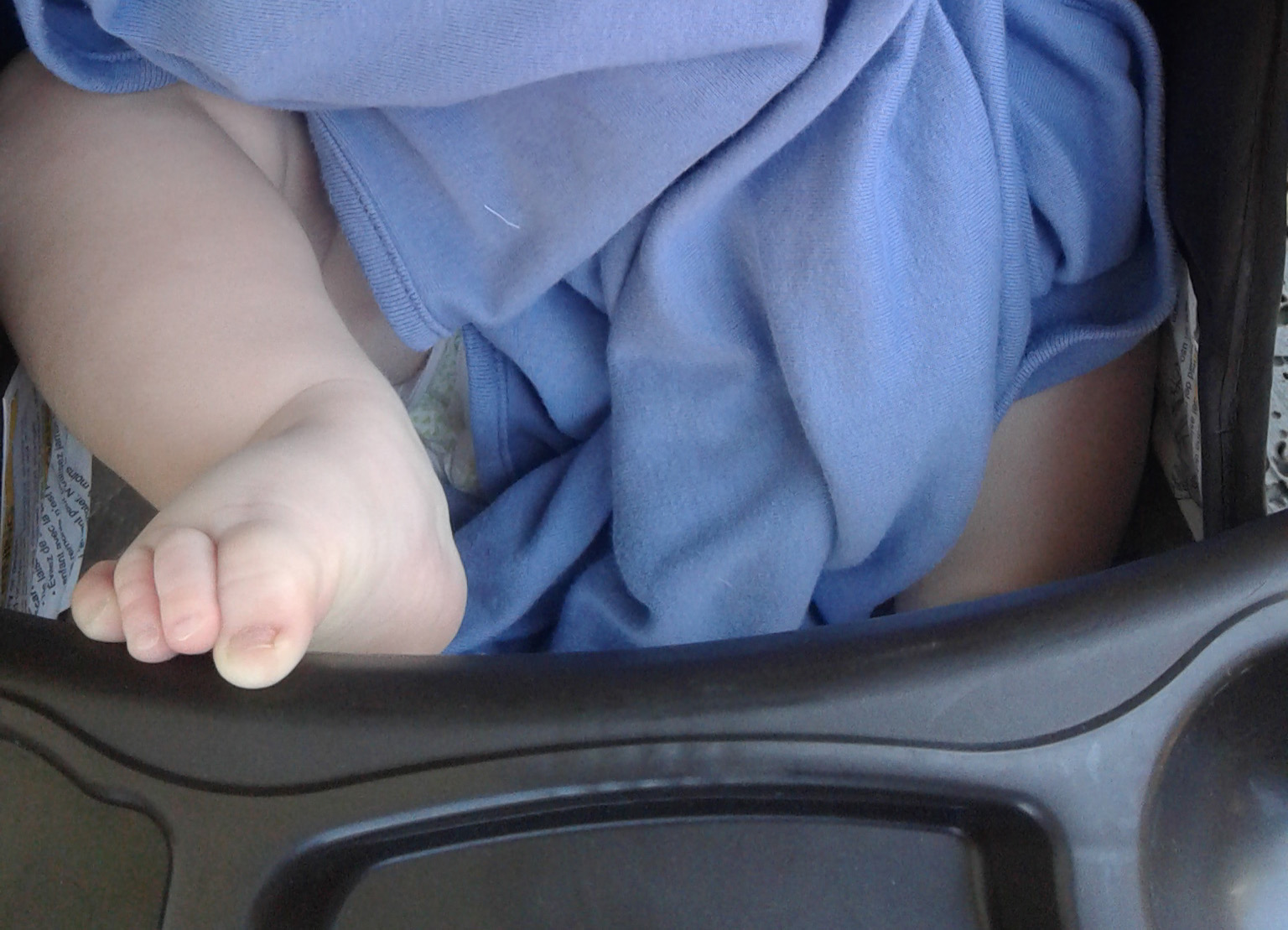 Photo: Victor in stroller with foot on tray