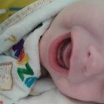 Photo of mouth with first tooth
