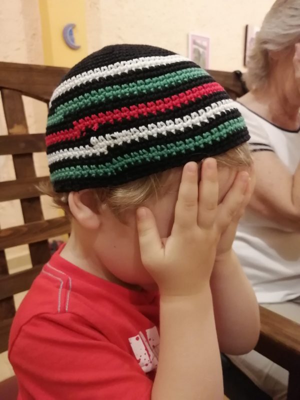 Victor covering eyes during Shabbat