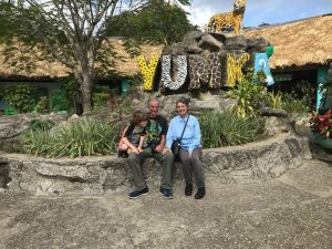 Photo: The three of us siting in front of the Yumka zoo sign.