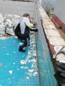 Photo: Victor and one of the parents removing tiles