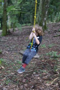 Photo of Victor on a swing